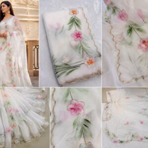 White saree with delicate pink and orange floral embroidery and green leaf motifs